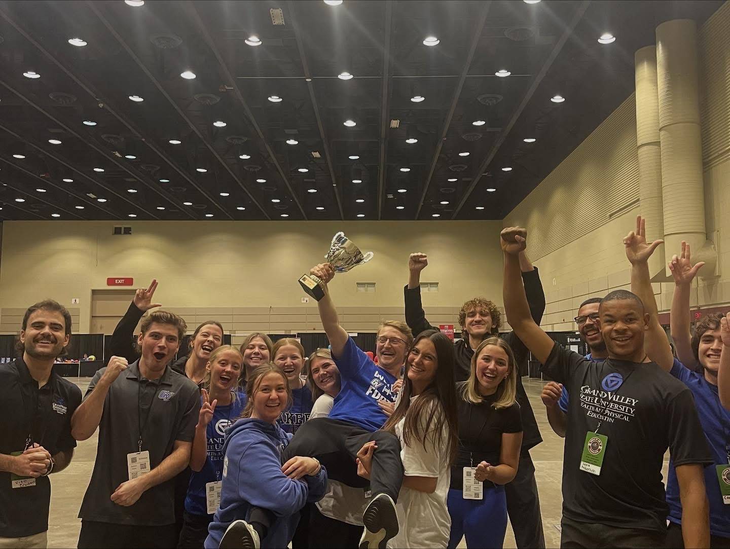 GVSU Students holding a trophy